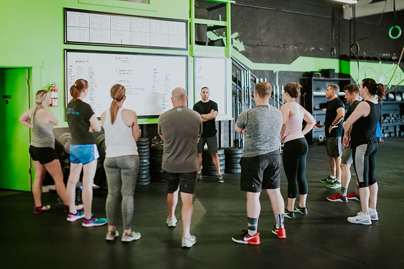 Coaches briefing a class at Armor Athletics