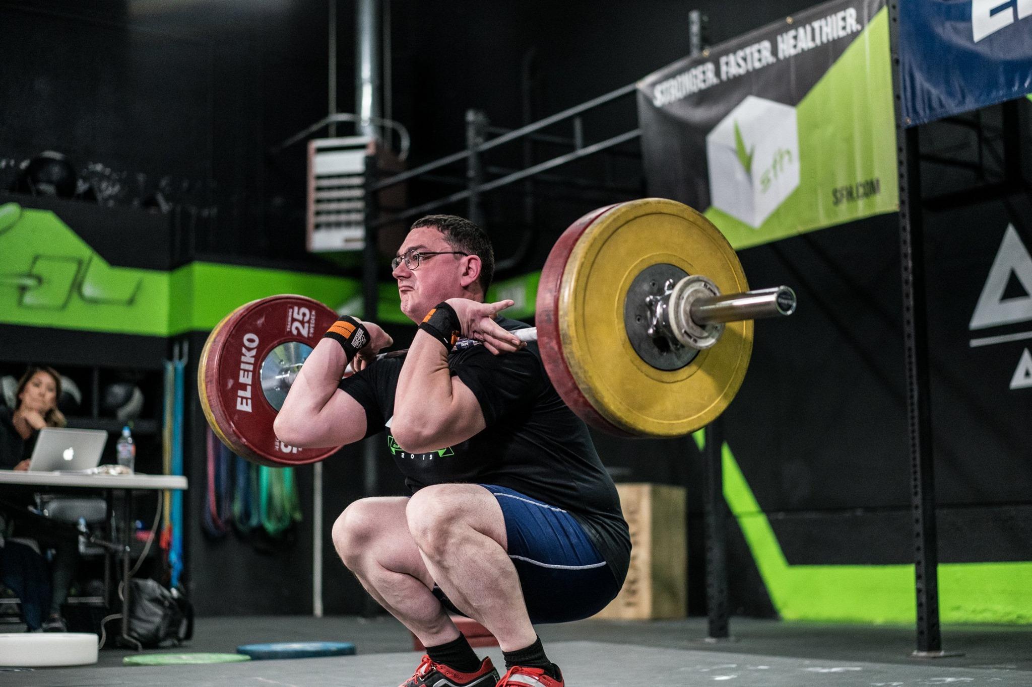 Athlete performing an Olympic lift at Armor Athletics